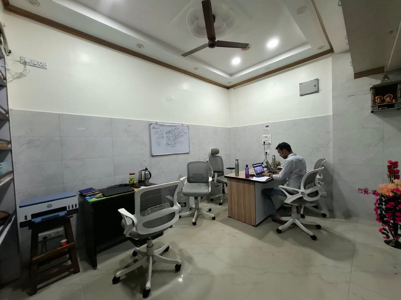 Wide angle perspective of the executive advisory suite and consultation desk at Sky-High Properties