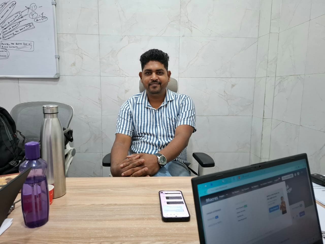 Senior property advisor seated at the executive consultation desk in Newtown office